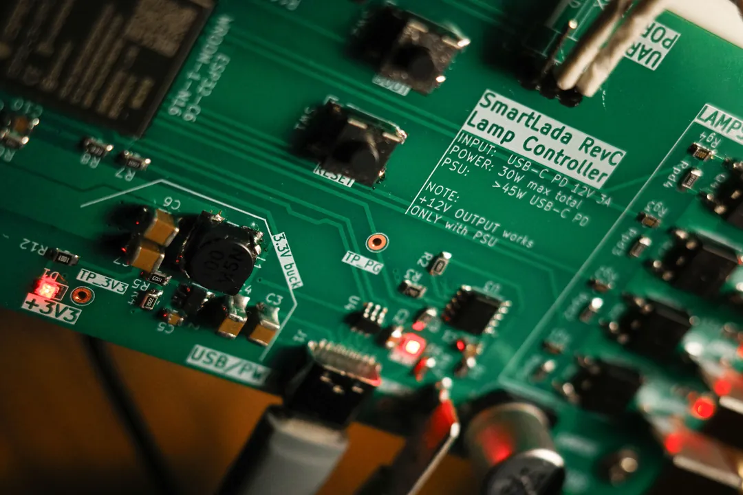Close-up of the SmartLada Rev C board with its indicator LEDs lit
